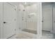 Modern bathroom featuring a glass shower with white subway tile and mosaic flooring at 7818 Russell Rd, Indian Trail, NC 28079