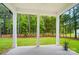 Covered porch with view to expansive lush lawn and mature trees at 7818 Russell Rd, Indian Trail, NC 28079
