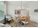 Charming dining room with a stylish modern chandelier and large window at 7818 Russell Rd, Indian Trail, NC 28079