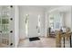Bright entryway featuring a white door with sidelights and wood flooring at 7818 Russell Rd, Indian Trail, NC 28079