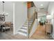 Welcoming foyer with staircase and clear sightlines to dining and living areas at 7818 Russell Rd, Indian Trail, NC 28079