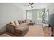 Comfortable living room with a large sectional sofa and natural light from the windows at 7818 Russell Rd, Indian Trail, NC 28079