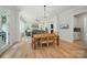 Spacious living and dining rooms with light wood floors and neutral paint tones at 7818 Russell Rd, Indian Trail, NC 28079