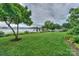 Backyard showcasing a well-manicured lawn and picturesque waterfront at 7945 Placid Ct, Denver, NC 28037