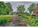 Charming single-story home featuring a well-maintained front yard and a long driveway at 7945 Placid Ct, Denver, NC 28037
