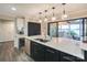 Contemporary kitchen featuring a large island with bar seating and modern appliances at 7945 Placid Ct, Denver, NC 28037