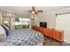 Inviting bedroom featuring a large window with views of the water, a ceiling fan, and modern decor at 7945 Placid Ct, Denver, NC 28037