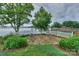 Paver patio with white picket fence and mature landscaping at 7945 Placid Ct, Denver, NC 28037
