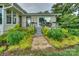 Covered patio featuring a dining set, black railings, and access to the home at 7945 Placid Ct, Denver, NC 28037