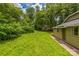 Lush backyard with green lawn and mature trees, offering a serene and private outdoor space at 807 3Rd St, Kings Mountain, NC 28086