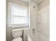 Cozy bathroom featuring white tile, a window with blinds, and a shower-tub combo at 807 3Rd St, Kings Mountain, NC 28086