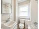 Cozy bathroom featuring white tile, a window with blinds, and a shower-tub combo at 807 3Rd St, Kings Mountain, NC 28086
