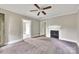 Carpeted bedroom featuring neutral walls, decorative fireplace, and ceiling fan at 807 3Rd St, Kings Mountain, NC 28086