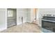 View of the kitchen with tiled floor, range, and access to bedroom at 807 3Rd St, Kings Mountain, NC 28086