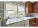 Charming kitchen featuring a classic sink under a window and traditional wood cabinets at 807 3Rd St, Kings Mountain, NC 28086