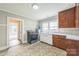 Bright kitchen featuring tiled floors, two toned cabinetry, and range at 807 3Rd St, Kings Mountain, NC 28086