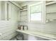 Storage area with built-in shelves and natural light, perfect for organizing household items and supplies at 807 3Rd St, Kings Mountain, NC 28086