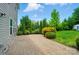 Enjoy outdoor living with this private patio, perfect for entertaining, with beautifully landscaped shrubbery at 8115 Kelburn Ln, Charlotte, NC 28273