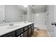 Bathroom featuring dual sinks and a shower-tub combination at 8115 Kelburn Ln, Charlotte, NC 28273