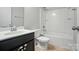 A bathroom with a vanity and a shower tub at 8115 Kelburn Ln, Charlotte, NC 28273