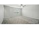 Spacious bedroom with plush carpeting and a ceiling fan at 8115 Kelburn Ln, Charlotte, NC 28273