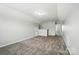 Spacious bonus room with neutral carpet offers plenty of room for activities and relaxation at 8115 Kelburn Ln, Charlotte, NC 28273