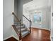 Inviting foyer with hardwood floors and a stylish chandelier at 8115 Kelburn Ln, Charlotte, NC 28273
