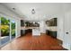 Open kitchen with dark cabinetry, an island, stainless steel appliances, and access to the backyard at 8115 Kelburn Ln, Charlotte, NC 28273