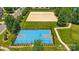 Overhead view of a well-maintained sports court with a basketball and a sand volleyball area at 8115 Kelburn Ln, Charlotte, NC 28273
