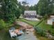 Aerial view of the backyard, dock and boats at this lakeside home at 8593 Bailey Dr, Terrell, NC 28682