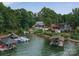 This aerial view showcases the home and property in relation to the lake, dock, and neighborhood at 8593 Bailey Dr, Terrell, NC 28682