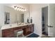 Bathroom vanity with large mirror, great lighting, and blue accents at 8593 Bailey Dr, Terrell, NC 28682