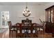 Traditional dining room featuring hardwood floors, a chandelier, and elegant furnishings, perfect for gatherings at 8593 Bailey Dr, Terrell, NC 28682