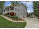 Charming two-story home with a welcoming front porch, landscaped yard, and convenient two-car garage at 8593 Bailey Dr, Terrell, NC 28682