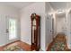 Bright foyer with wood floors, a decorative glass door and beautiful, grandfather clock at 8593 Bailey Dr, Terrell, NC 28682