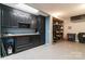Well-organized garage featuring custom cabinets, a workbench area, and visible storage space at 8593 Bailey Dr, Terrell, NC 28682