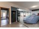Garage with large refrigerator, storage shelves and covered car at 8593 Bailey Dr, Terrell, NC 28682