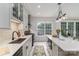 Bright kitchen with an island, ample counter space, modern appliances, and a view to the outdoors at 8593 Bailey Dr, Terrell, NC 28682