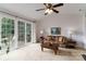 Bright living room featuring sliding glass doors to an outdoor deck, filling the space with natural light at 8593 Bailey Dr, Terrell, NC 28682