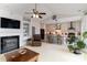 Open-concept living area with fireplace, blending seamlessly into a modern kitchen with island seating at 8593 Bailey Dr, Terrell, NC 28682