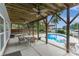 Covered patio overlooking a refreshing pool and lake, creating a perfect outdoor oasis at 8593 Bailey Dr, Terrell, NC 28682