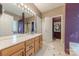 Bathroom with a large vanity, marble floors, separate shower, and soaking tub at 901 Clearbrook Rd, Matthews, NC 28105