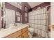 Functional bathroom showcasing a vanity, toilet, and shower with curtain at 901 Clearbrook Rd, Matthews, NC 28105