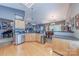 This open kitchen boasts granite countertops, modern appliances, and seamless flow to the dining area at 901 Clearbrook Rd, Matthews, NC 28105