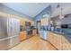 Functional kitchen with stainless steel appliances, granite countertops, and hardwood floors at 901 Clearbrook Rd, Matthews, NC 28105