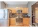 Well-equipped kitchen with stainless steel refrigerator, range, and stylish backsplash at 901 Clearbrook Rd, Matthews, NC 28105