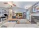 Comfortable living space includes vaulted ceiling, fireplace, and view of the piano and entry hall at 901 Clearbrook Rd, Matthews, NC 28105