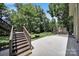 Inviting backyard with a concrete patio and wooden deck for relaxing and entertaining guests at 926 Meadow Lakes Rd, Rock Hill, SC 29732