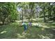 Relaxing backyard with a stone fire pit and colorful chairs to socialize with friends and Gathering at 926 Meadow Lakes Rd, Rock Hill, SC 29732
