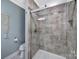 Bathroom featuring tiled shower with glass door, toilet, and neutral-toned walls at 926 Meadow Lakes Rd, Rock Hill, SC 29732